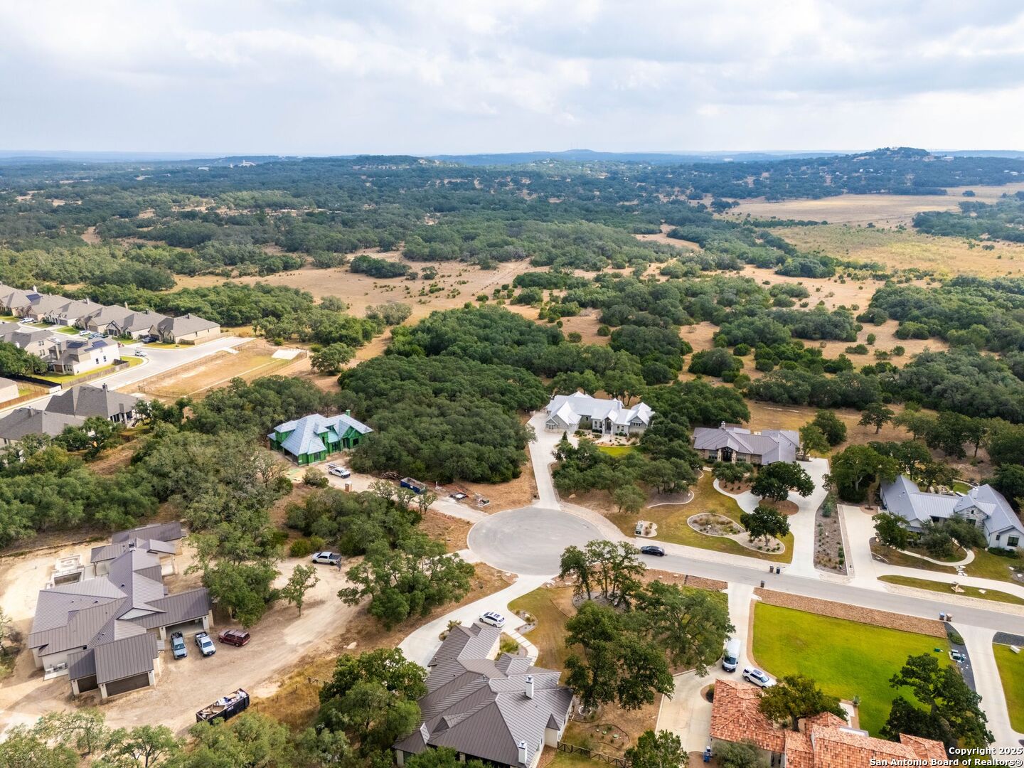 34858 Last Stage Way Bulverde, TX 78163 - Photo 7 of 16 an aerial view of a city with lots of residential buildings ocean and mountain view in back