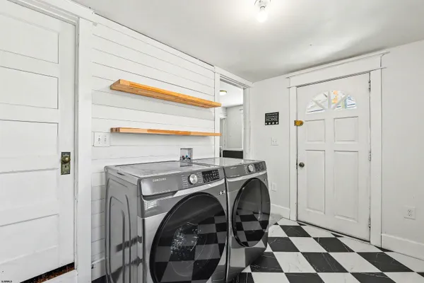 a view of a storage & utility room with washer and dryer