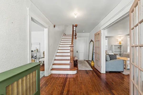 a view of a bedroom with furniture and stairs
