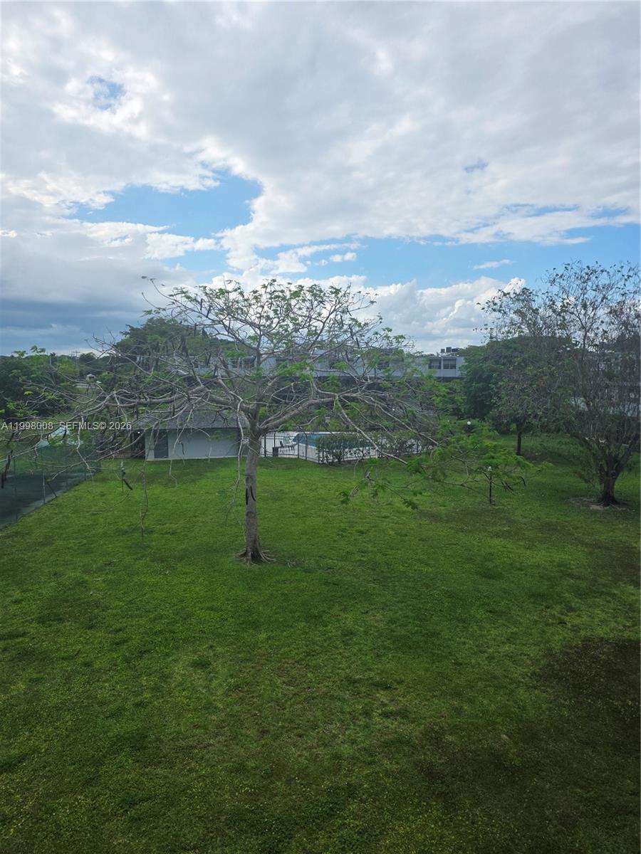 9500 Southwest 3rd Street, Unit 259 Boca Raton, FL 33428 - Photo 2 of 10 a view of a city with lush green forest