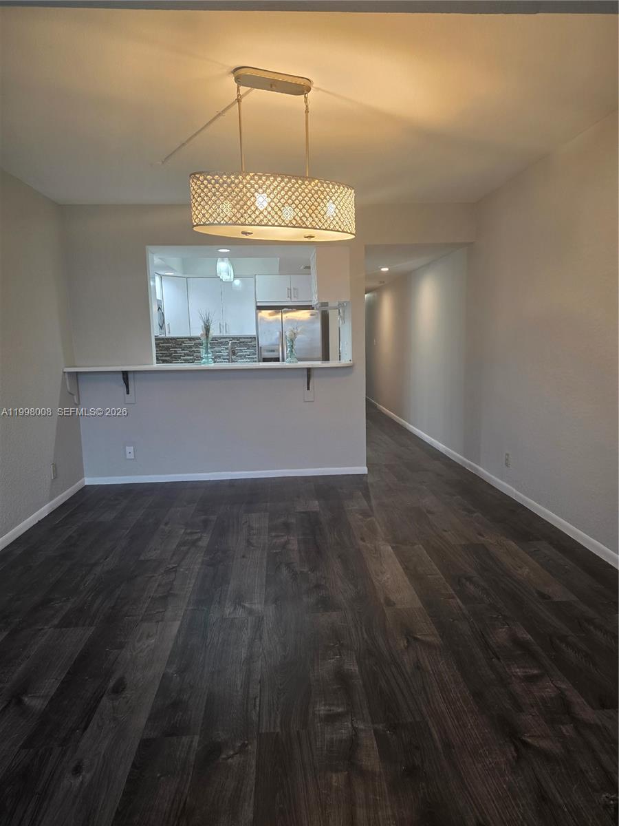 9500 Southwest 3rd Street, Unit 259 Boca Raton, FL 33428 - Photo 9 of 10 a view of a room with a wooden floor