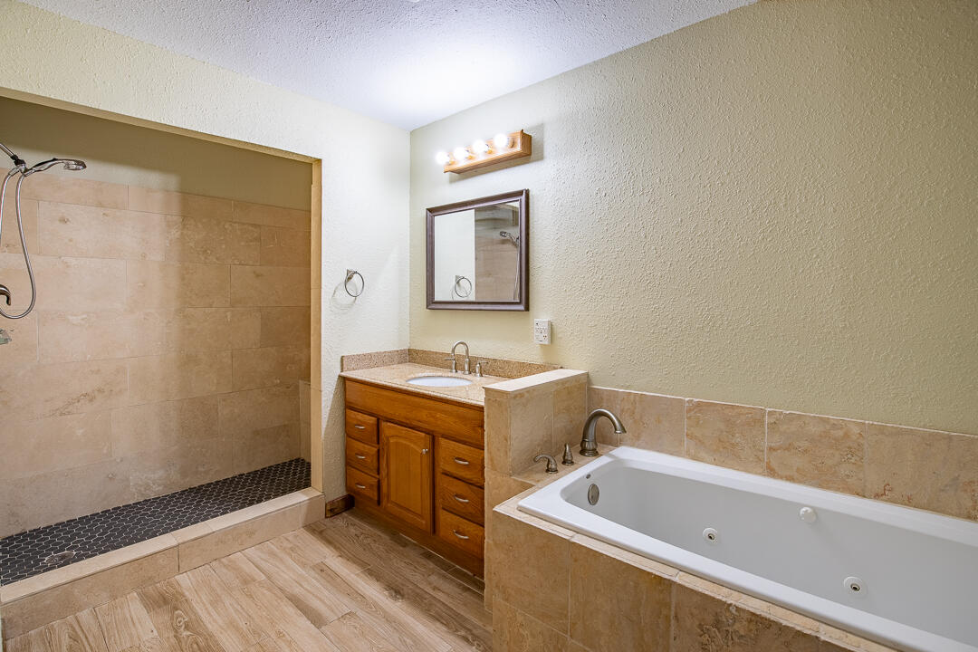 5503 Raintree Trail Fort Pierce, FL 34982 - Photo 20 of 34 a bathroom with a tub sink and mirror
