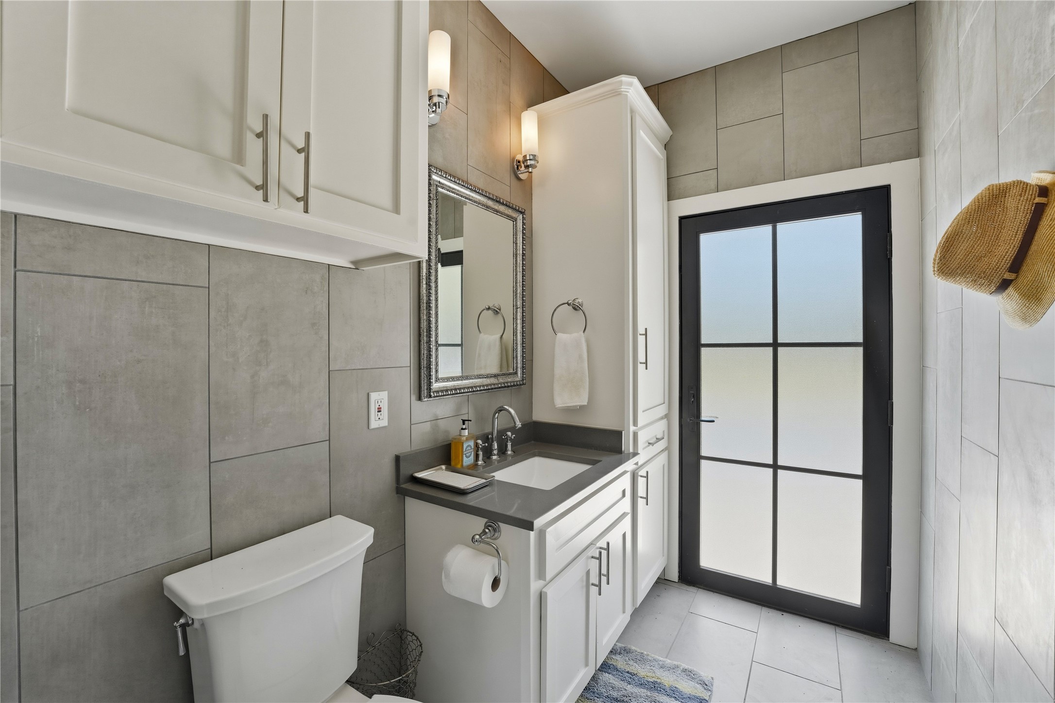 1124 Bowie Street Columbus, TX 78934 - Photo 26 of 28 a bathroom with a granite countertop sink and a toilet