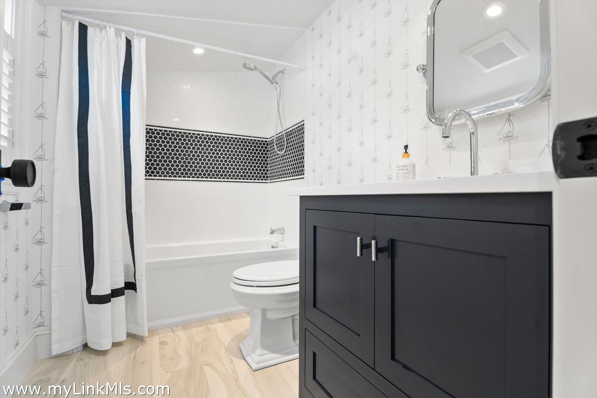 43 Peases Point Way South Edgartown, MA 02539 - Photo 34 of 52 a bathroom with a sink a toilet and shower