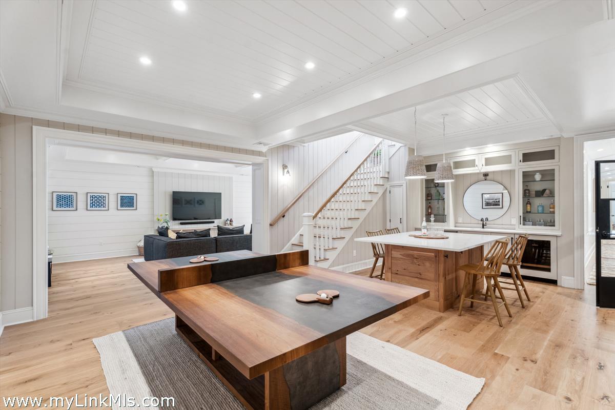 43 Peases Point Way South Edgartown, MA 02539 - Photo 37 of 52 a living room with furniture a rug and a flat screen tv