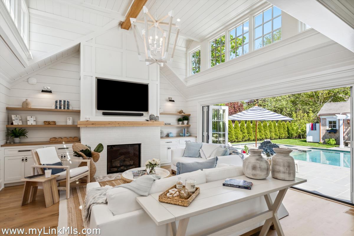 43 Peases Point Way South Edgartown, MA 02539 - Photo 5 of 52 a living room with furniture fireplace and a large window