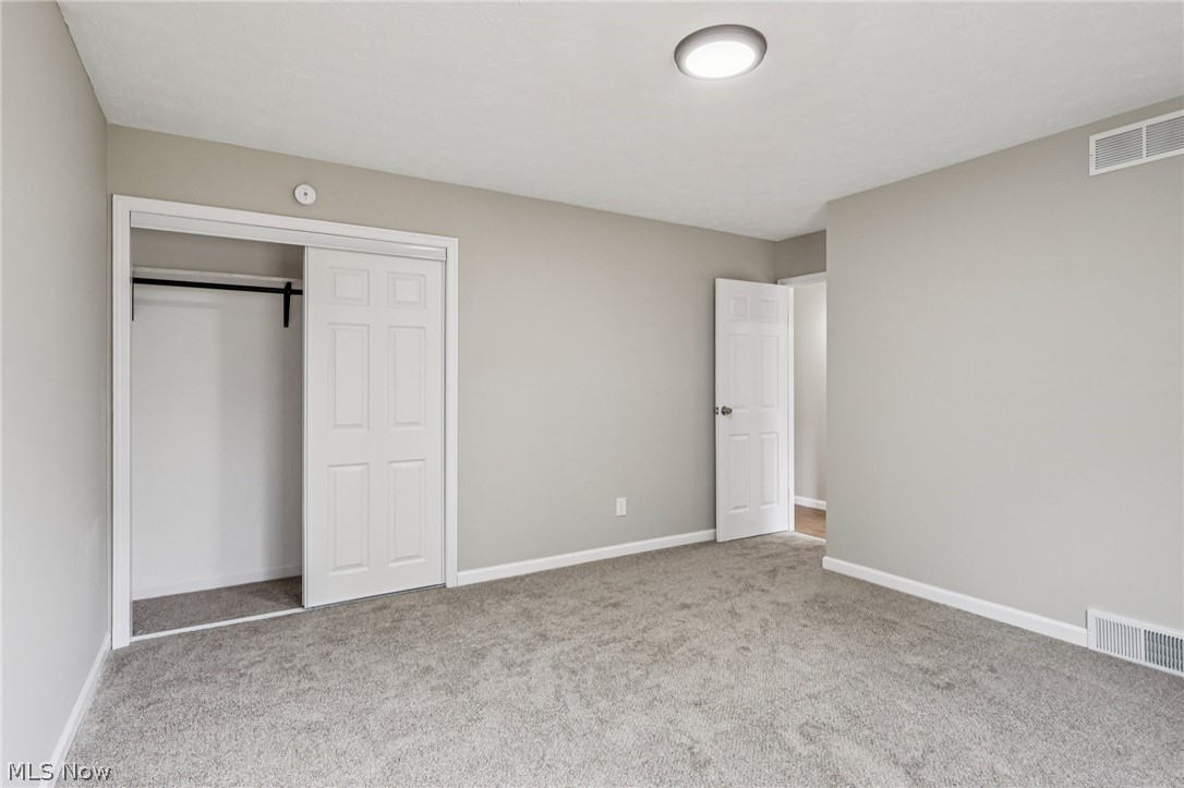 2829 Tibbetts Wick Road Hubbard, OH 44425 - Photo 17 of 44 Unfurnished bedroom with a closet and carpet