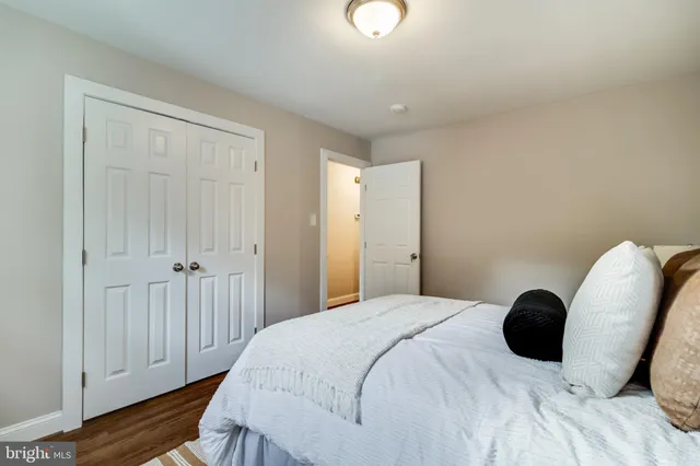 a bedroom with a bed and a chair