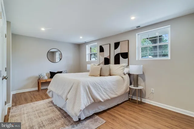 a bedroom with a large bed and a window