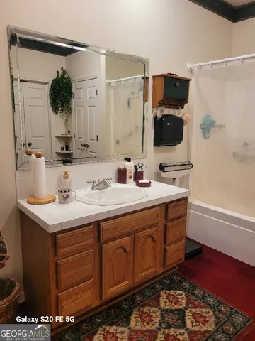 a bathroom with a sink and a mirror
