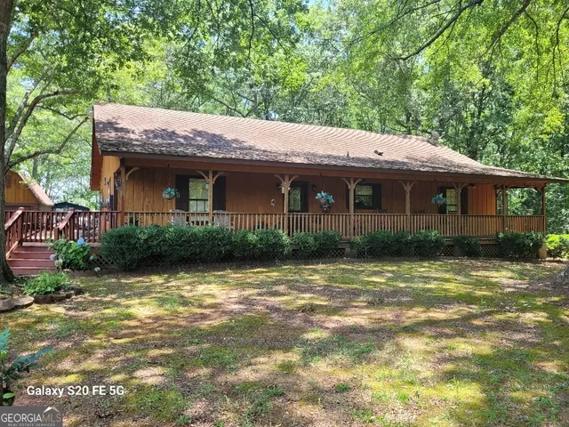 a view of a house with a small yard