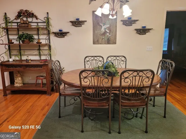a view of a chairs and table in a kitchen