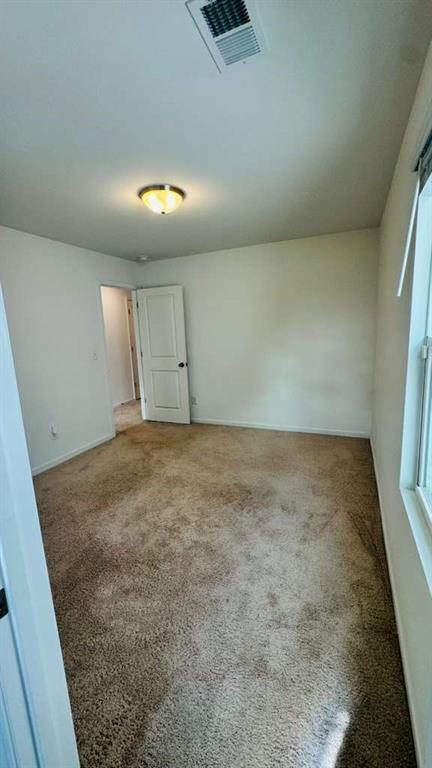 4078 Haleston Road Duluth, GA 30097 - Photo 15 of 25 wooden floor in an empty room with a window