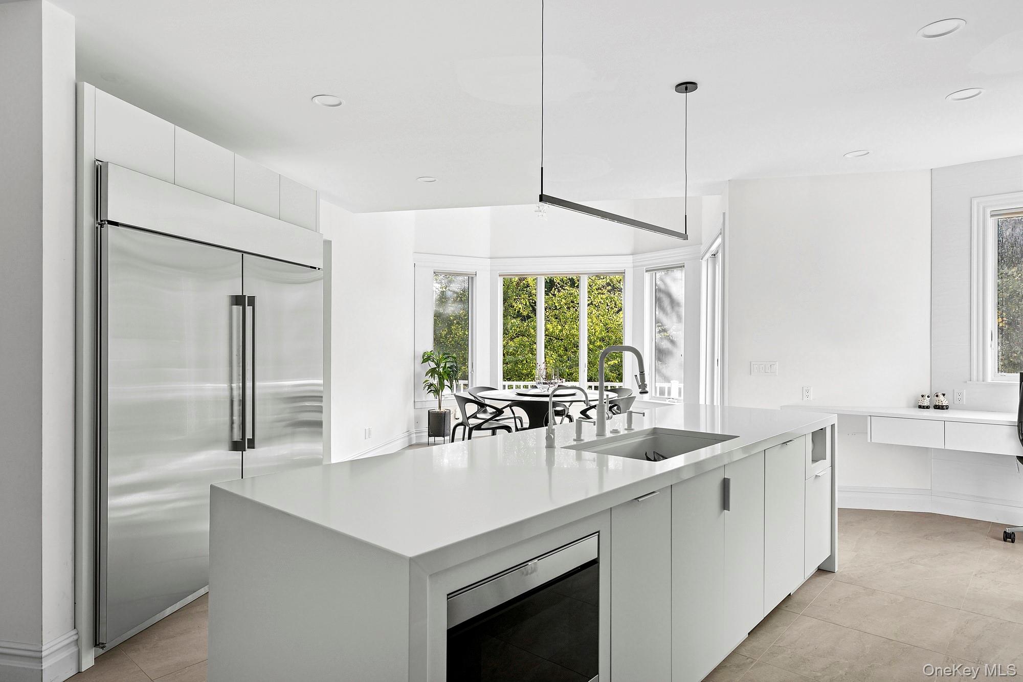 144 Round Swamp Road West Hills, NY 11743 - Photo 10 of 39 Kitchen featuring modern cabinets, white cabinets, built in appliances, a center island with sink, and recessed lighting
