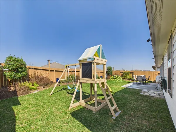 a view of a yard with a slide