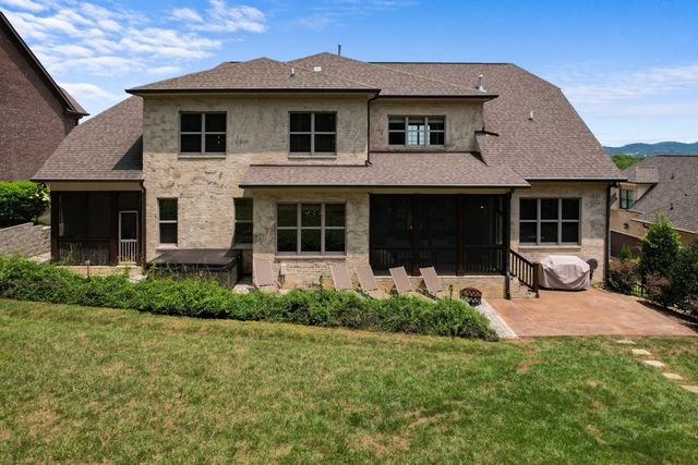 an aerial view of residential houses with outdoor space and street view