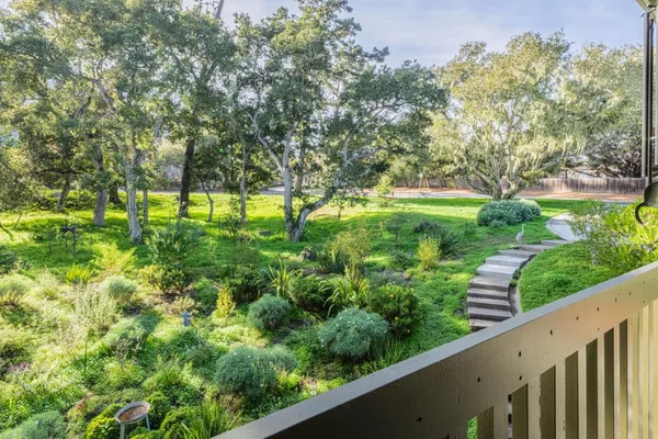 a view of a garden from a balcony