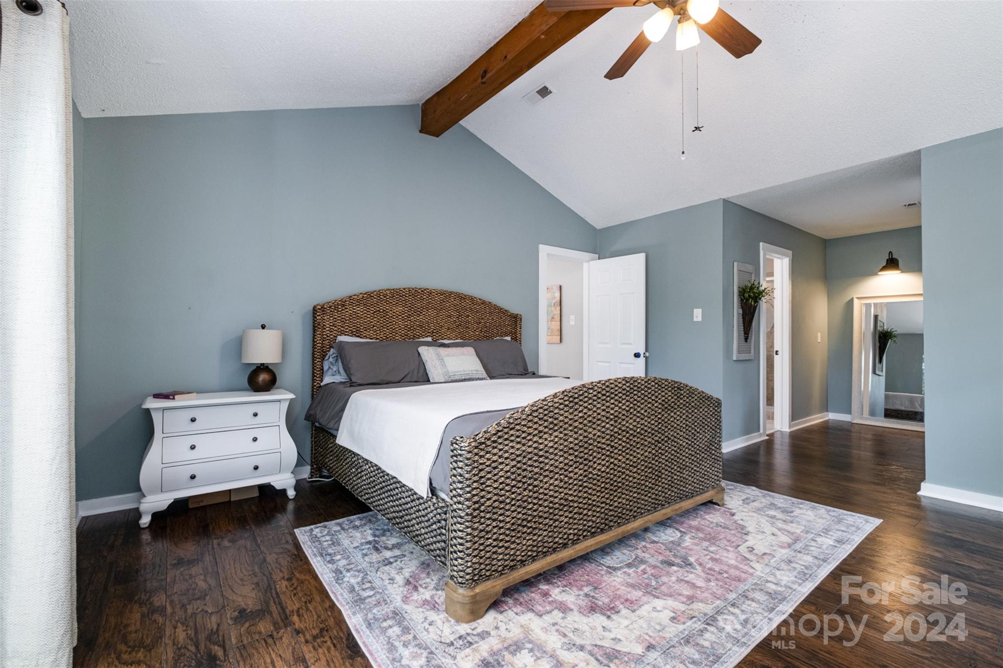 4033 Windward Drive Tega Cay, SC 29708 - Photo 20 of 38 a bedroom with a bed and a chandelier
