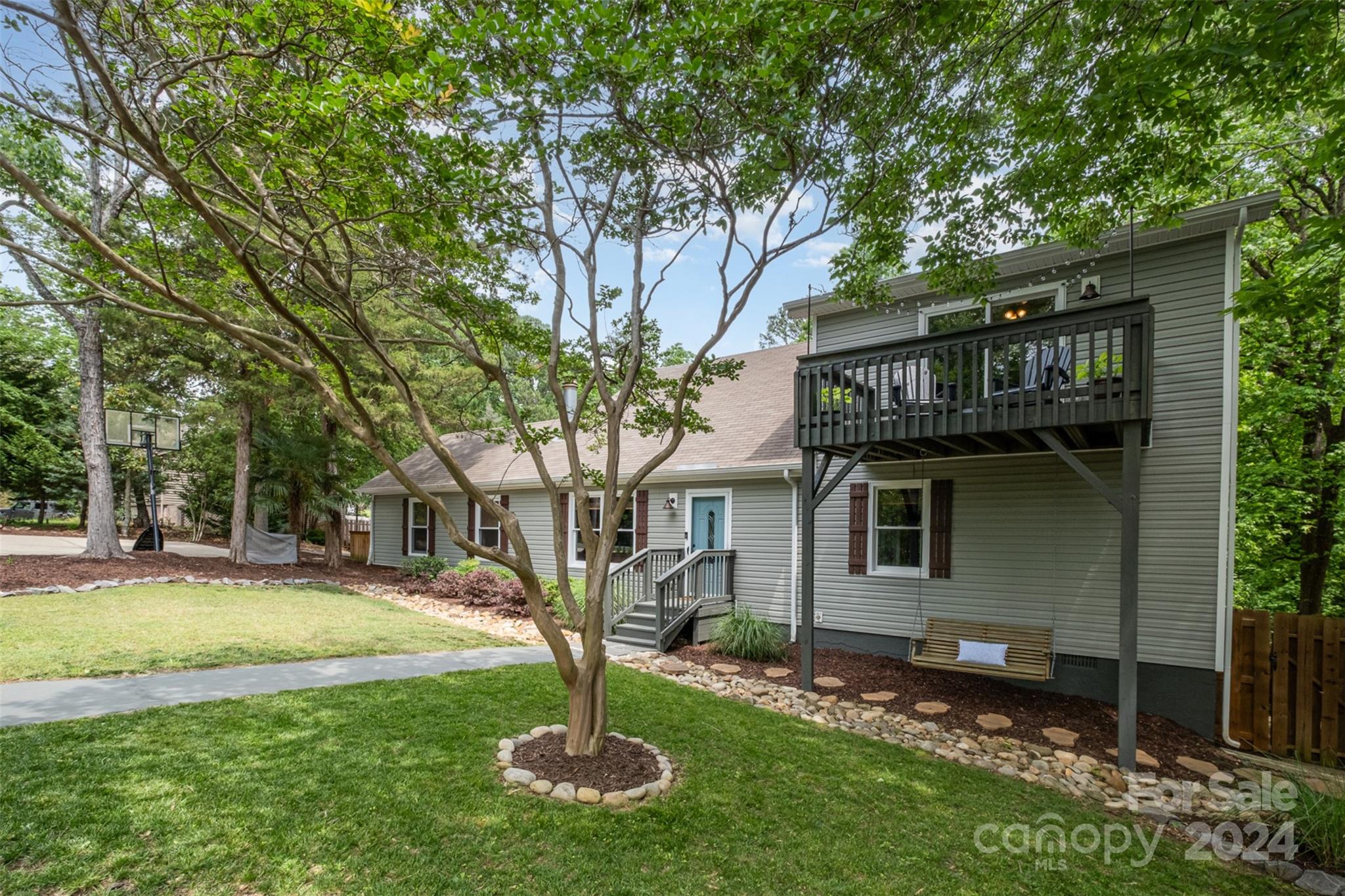 4033 Windward Drive Tega Cay, SC 29708 - Photo 2 of 38 a front view of a house with a yard