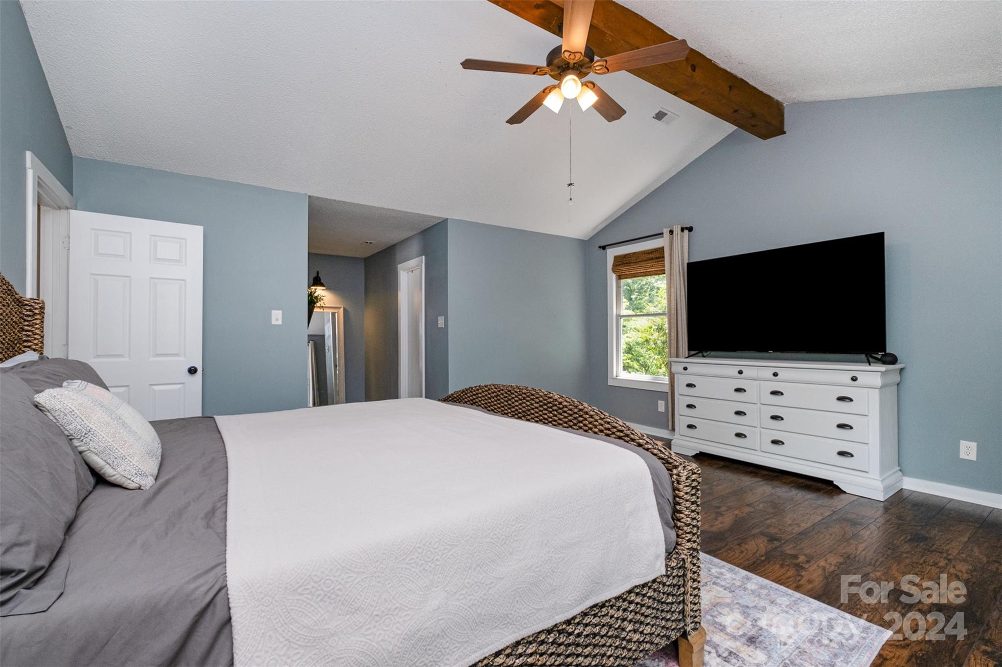 4033 Windward Drive Tega Cay, SC 29708 - Photo 21 of 38 a bedroom with a bed and a flat screen tv
