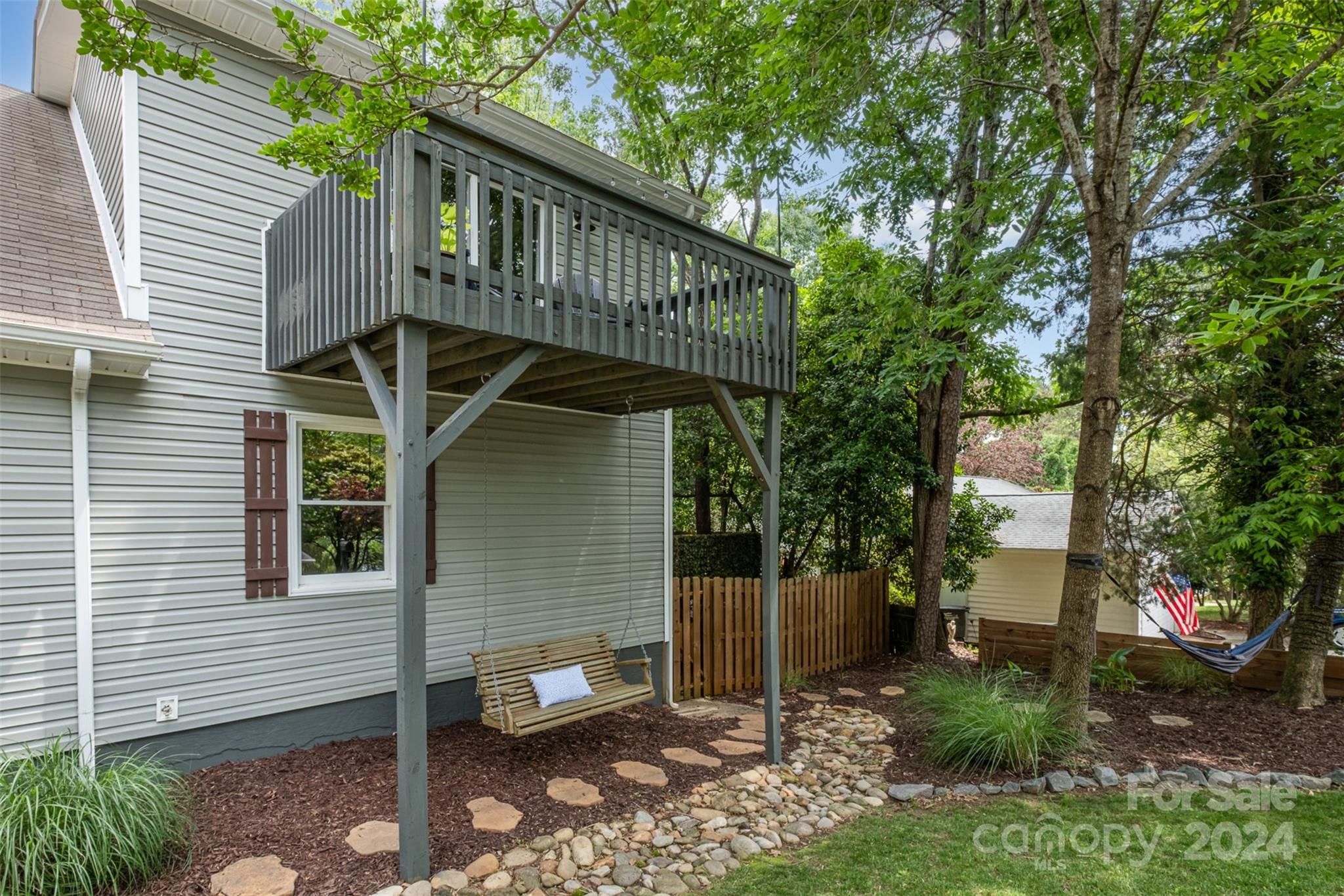 4033 Windward Drive Tega Cay, SC 29708 - Photo 25 of 38 a front view of a house with garden