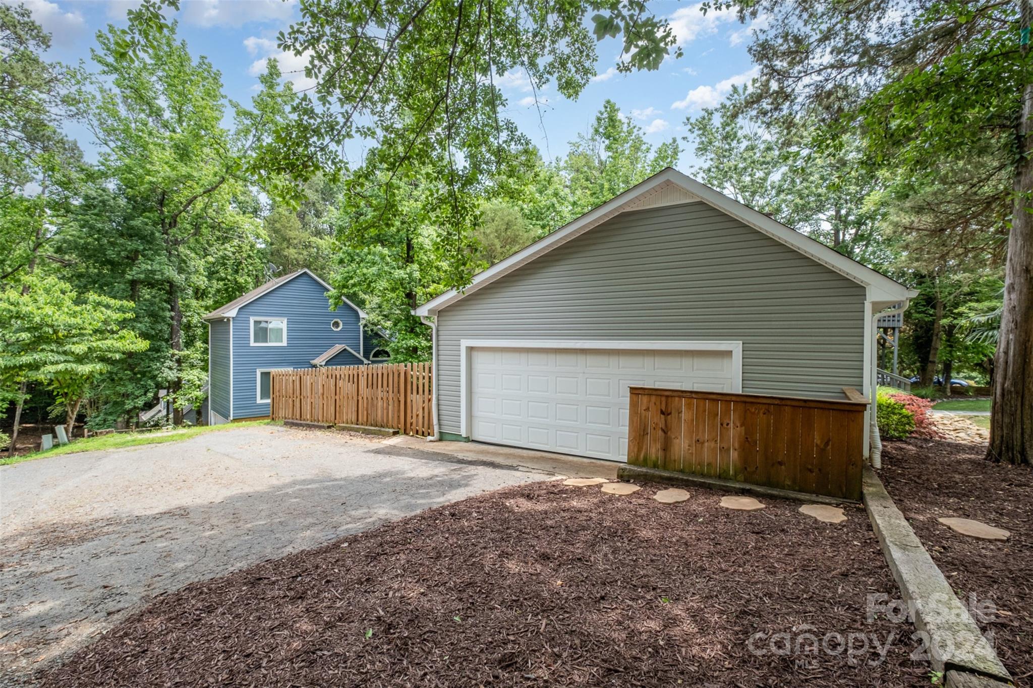4033 Windward Drive Tega Cay, SC 29708 - Photo 28 of 38 a view of house with backyard and wooden fence