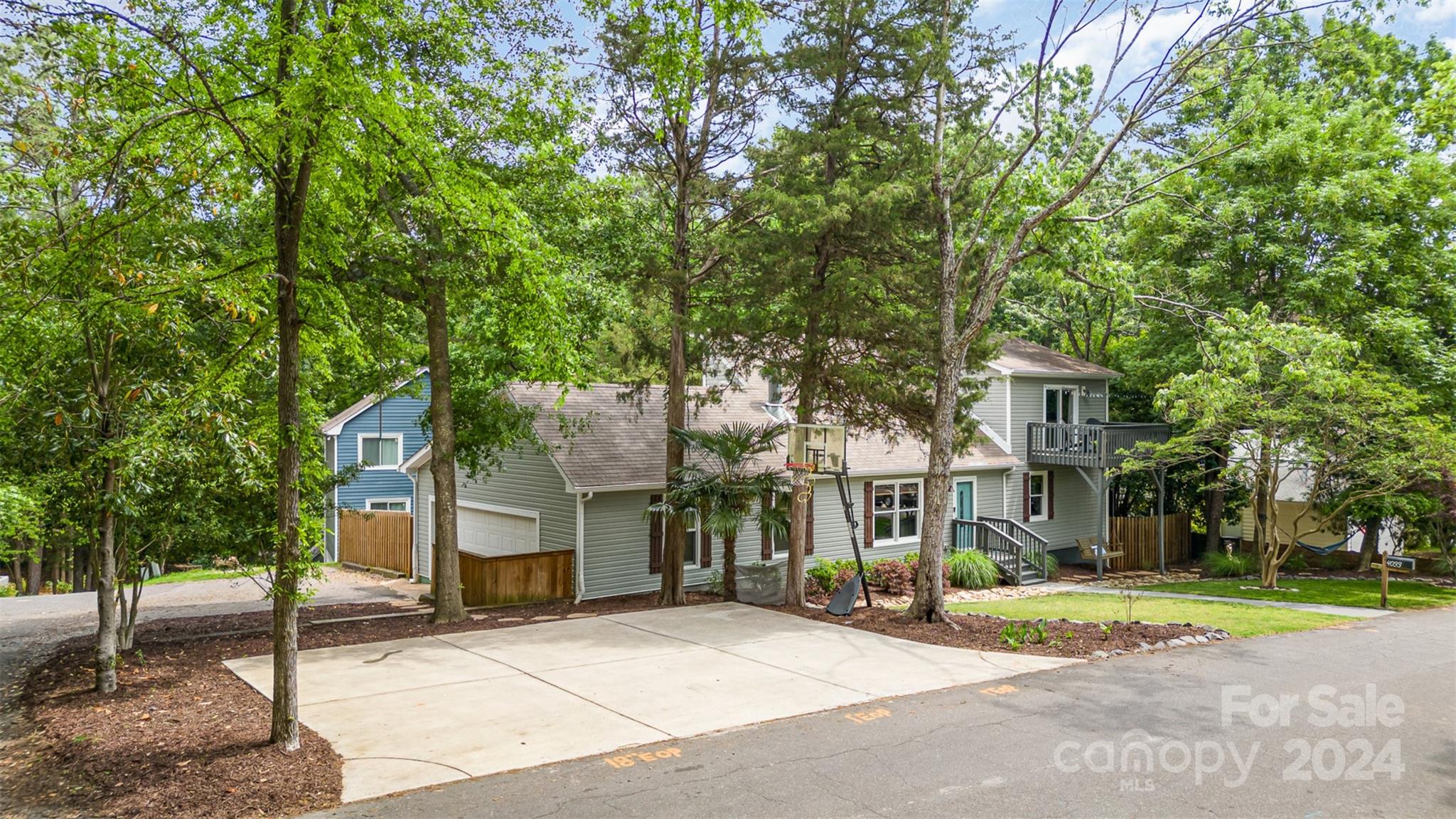 4033 Windward Drive Tega Cay, SC 29708 - Photo 29 of 38 a front view of a house with a yard and garage