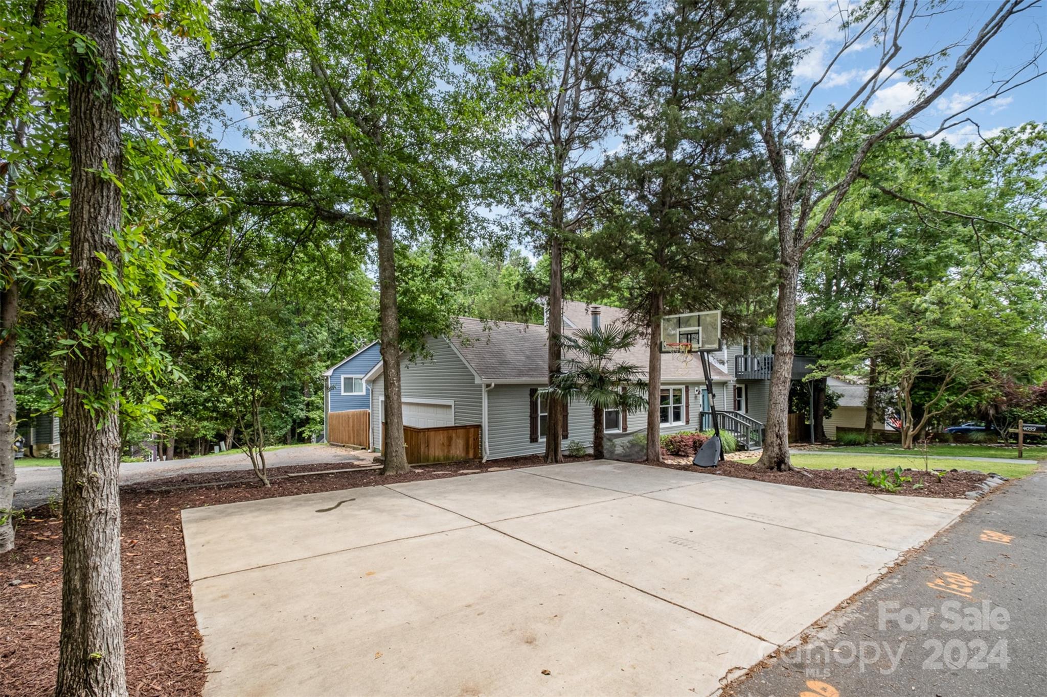 4033 Windward Drive Tega Cay, SC 29708 - Photo 30 of 38 a view of a house with a street