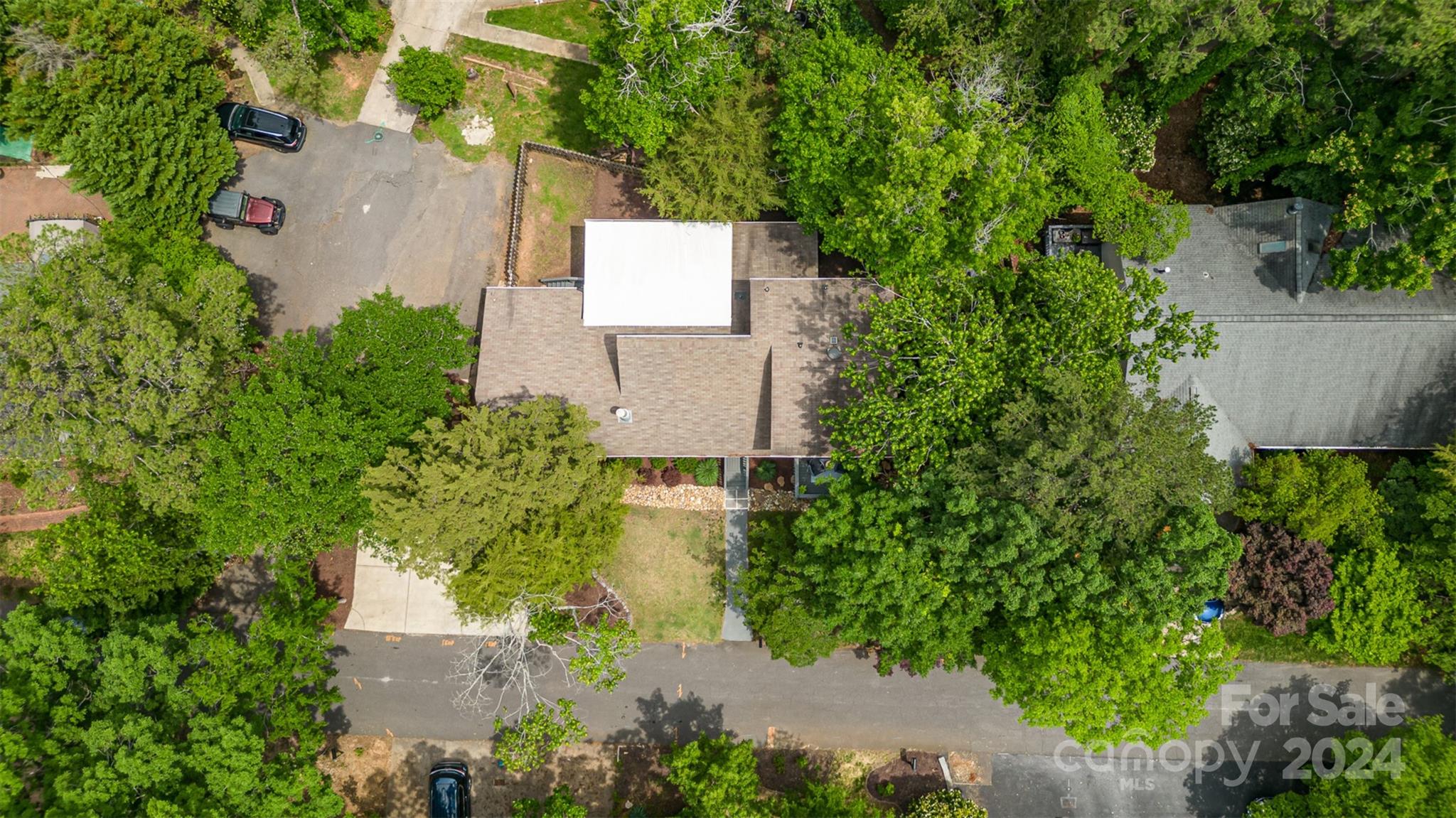 4033 Windward Drive Tega Cay, SC 29708 - Photo 31 of 38 an aerial view of a house with a yard and garden