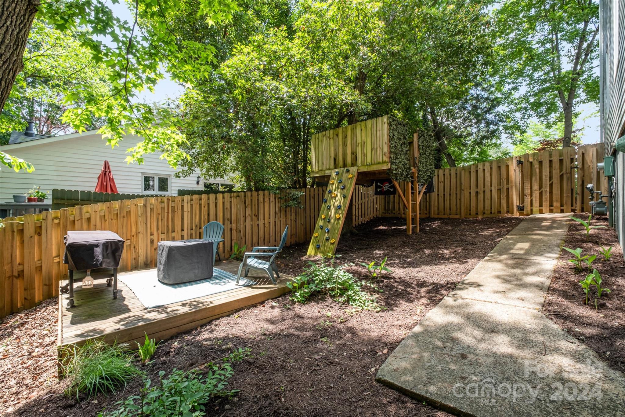 4033 Windward Drive Tega Cay, SC 29708 - Photo 35 of 38 a view of a backyard with a swing