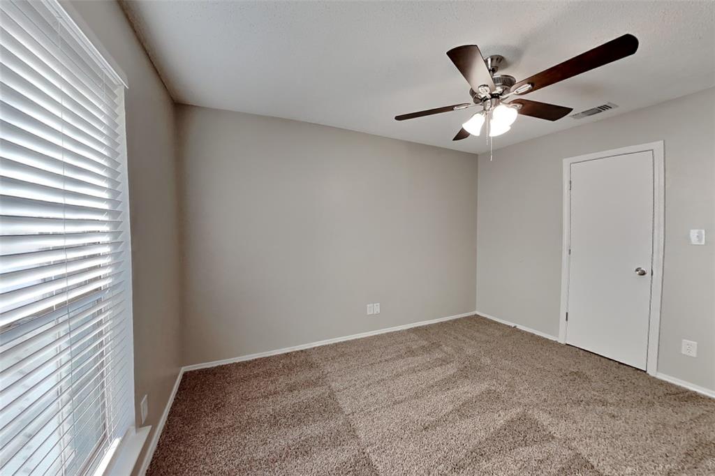 4013 David Circle Rowlett, TX 75088 - Photo 13 of 19 a view of an empty room with wooden floor and a window