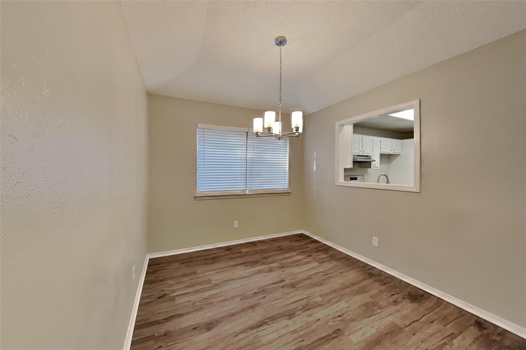 4013 David Circle Rowlett, TX 75088 - Photo 6 of 19 a view of an empty room with window and wooden floor