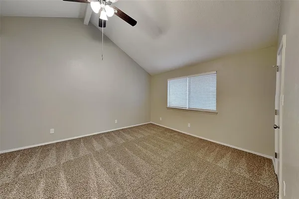 an empty room with a empty space and a window