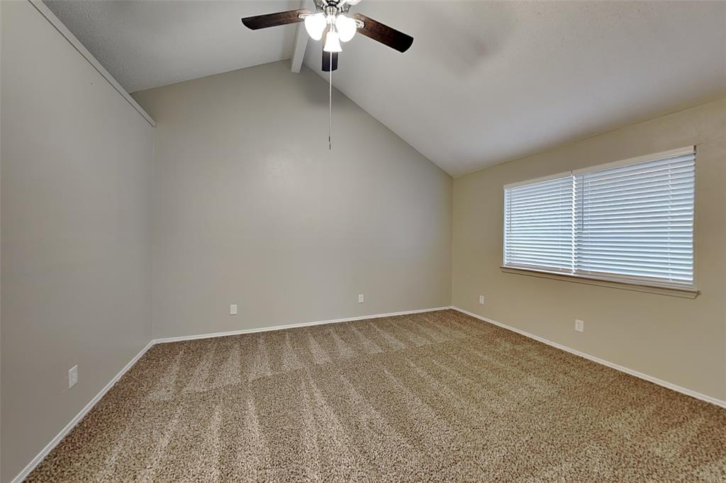 4013 David Circle Rowlett, TX 75088 - Photo 9 of 19 an empty room with a chandelier fan and windows