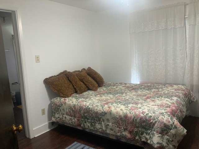 850 Slade Street Coldspring, TX 77331 - Photo 13 of 31 a bedroom with a bed and a window