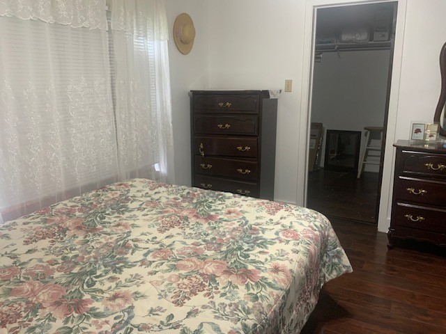 850 Slade Street Coldspring, TX 77331 - Photo 14 of 31 a bedroom with a bed and a dresser