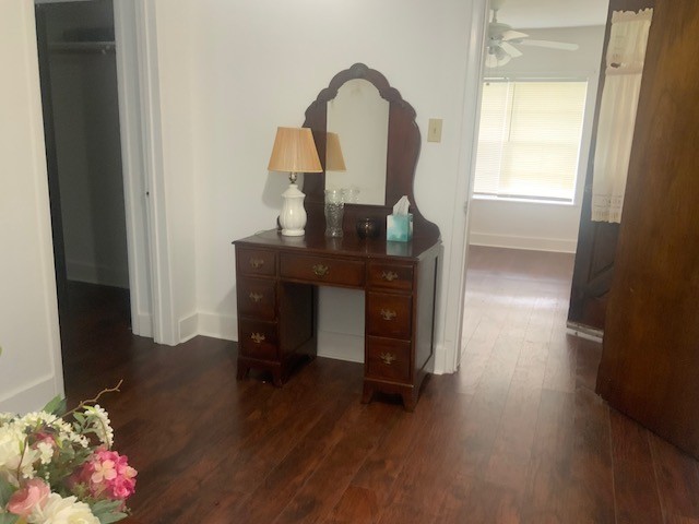 850 Slade Street Coldspring, TX 77331 - Photo 22 of 31 a view of a workspace room with wooden floor table and windows