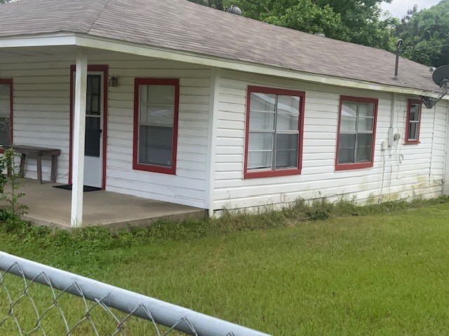 850 Slade Street Coldspring, TX 77331 - Photo 4 of 31 a front view of a house with a garden