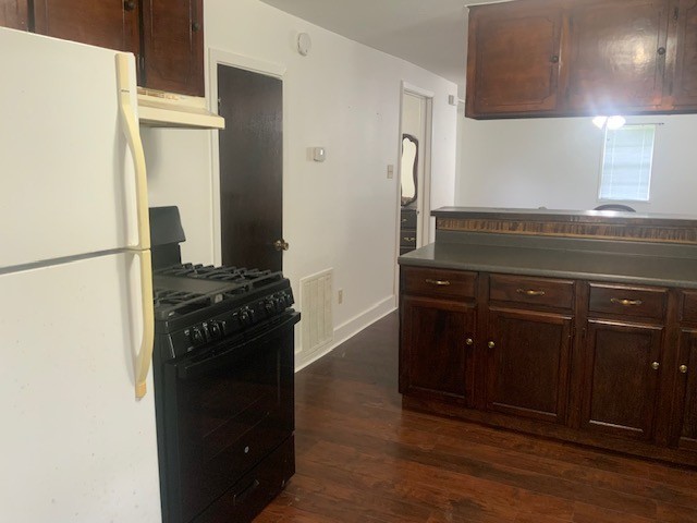 850 Slade Street Coldspring, TX 77331 - Photo 9 of 31 a kitchen with a refrigerator and a stove