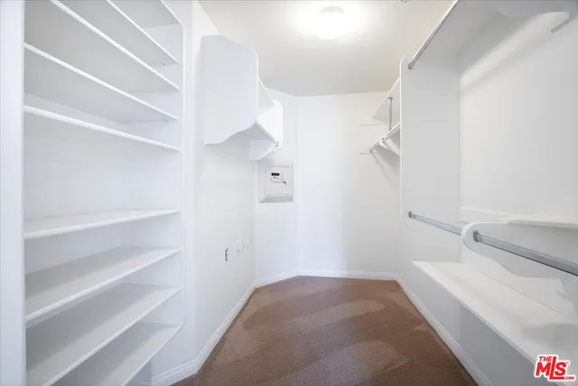 a bathroom with a double vanity sink toilet and a mirror