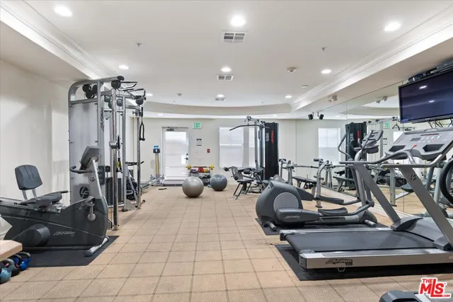 an aerial view of a residential apartment building with a yard