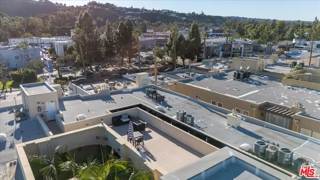 a front view of a residential apartment building with a yard