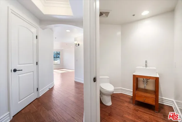 a bathroom with a toilet sink and shower