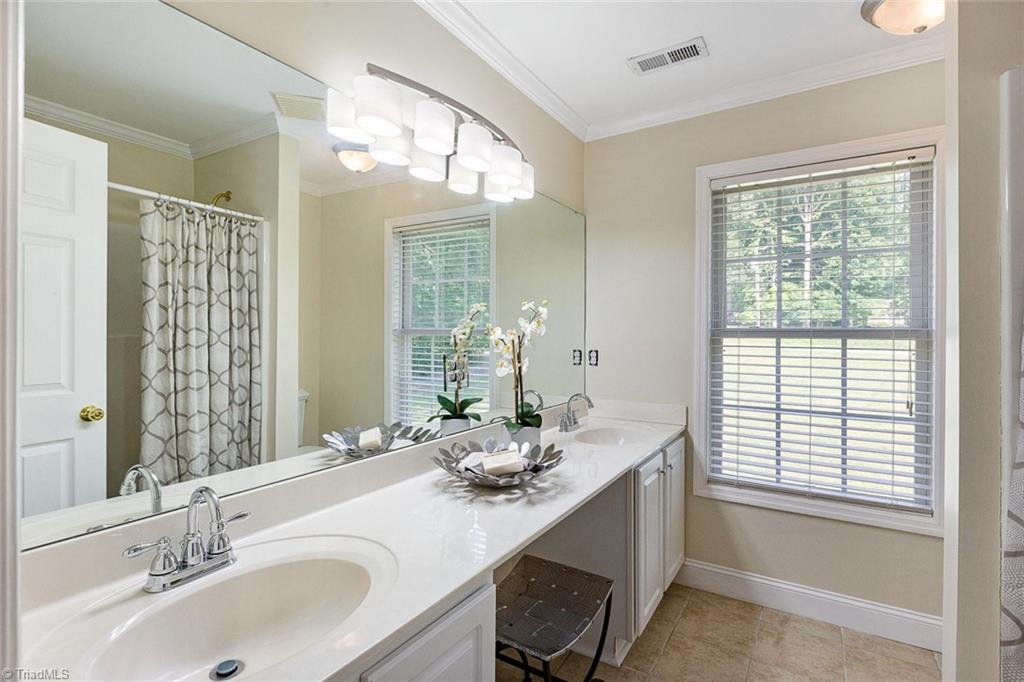1117 Tangle Lane High Point, NC 27265 - Photo 19 of 29 Master bath has separate vanities, new faucets and new light fixtures.