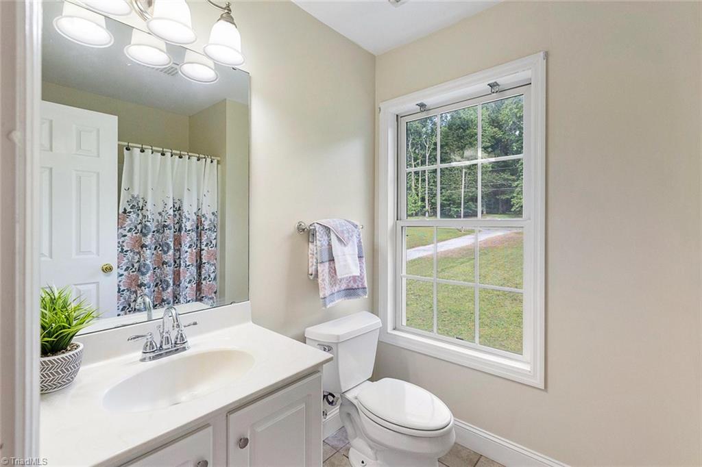 1117 Tangle Lane High Point, NC 27265 - Photo 21 of 29 Hall Bathroom upstairs has new faucet and new light fixture.