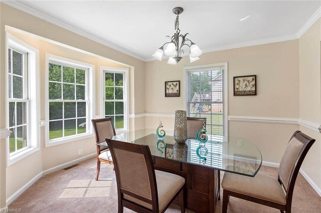 1117 Tangle Lane High Point, NC 27265 - Photo 6 of 29 Bay window gives the formal dining room lots of natural light and extra space.