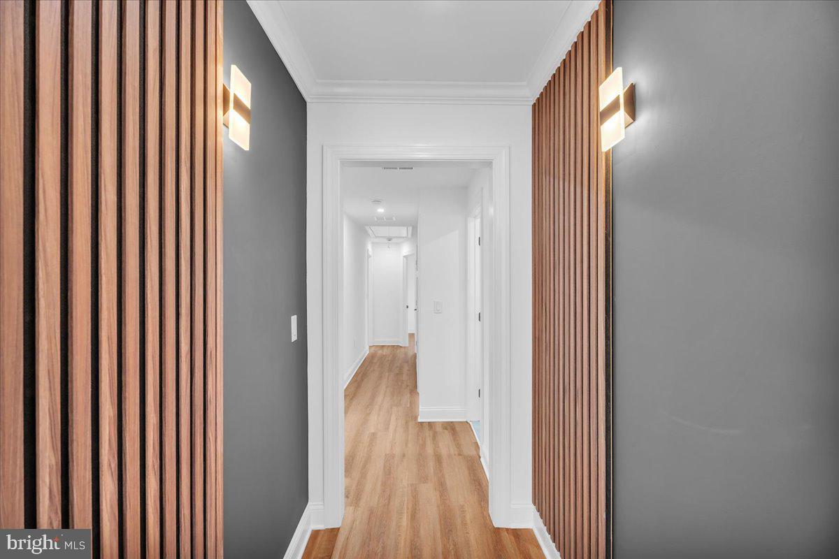 2504 Church Road Cinnaminson, NJ 08077 - Photo 48 of 79 a view of a hallway with wooden floor and a bathroom