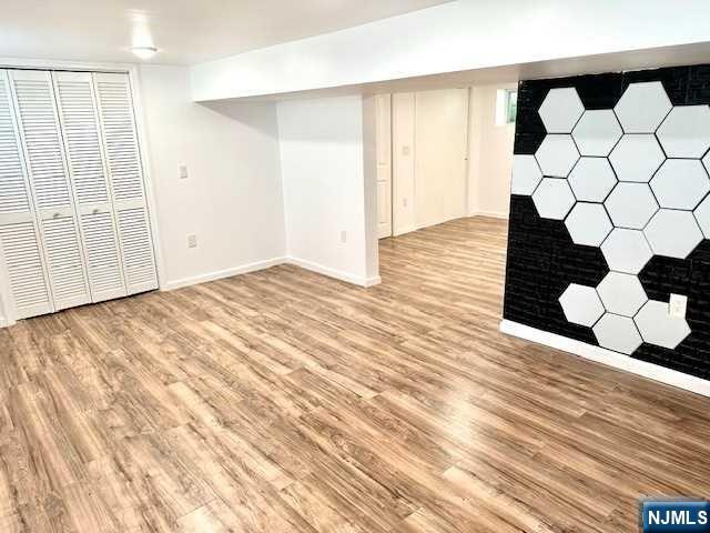 1249 Beaumont Avenue Teaneck, NJ 07666 - Photo 15 of 23 a view of empty room with wooden floor