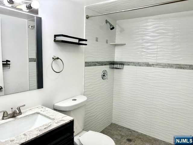 1249 Beaumont Avenue Teaneck, NJ 07666 - Photo 18 of 23 a bathroom with a sink a toilet and shower