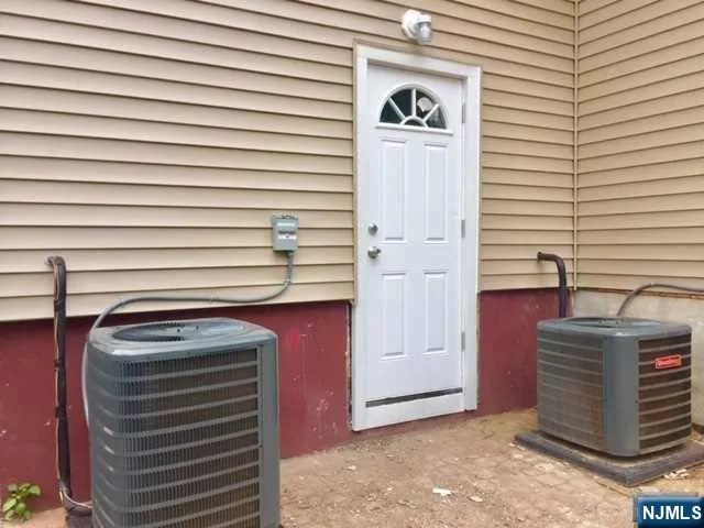 a view of a door and a microwave